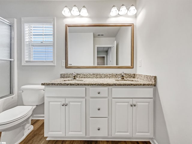 163 Highland Park Ct, Easley, SC 29642 - bathroom with an enclosed shower, double vanity, and wood finished floors