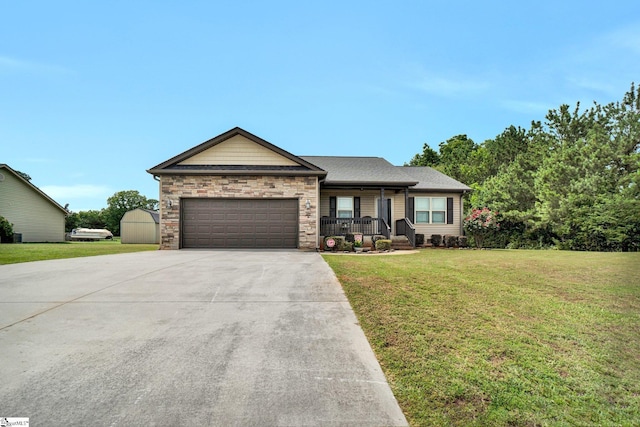 102 Tea Leaf Ct, Anderson, SC 29626 - ranch-style house featuring driveway, an attached garage, a front lawn, stone siding, and covered porch