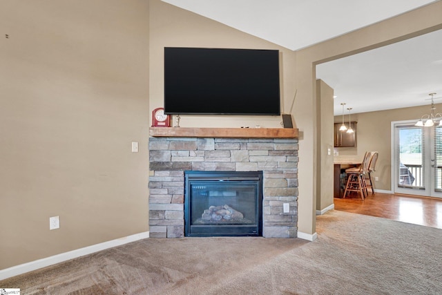 102 Tea Leaf Ct, Anderson, SC 29626 - detailed view of carpet flooring, a stone fireplace, and a chandelier