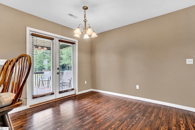 102 Tea Leaf Ct, Anderson, SC 29626 - spare room featuring wood finished floors, a chandelier, and french doors