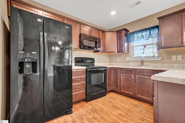 102 Tea Leaf Ct, Anderson, SC 29626 - kitchen featuring black appliances, light wood finished floors, light countertops, and recessed lighting