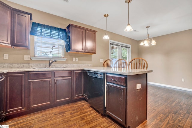 102 Tea Leaf Ct, Anderson, SC 29626 - kitchen with dishwasher, dark wood-style flooring, a peninsula, a chandelier, and pendant lighting