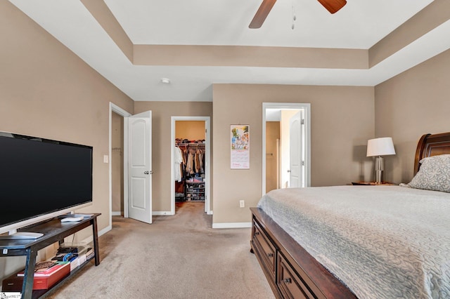 102 Tea Leaf Ct, Anderson, SC 29626 - bedroom with a walk in closet, light carpet, a raised ceiling, and a closet