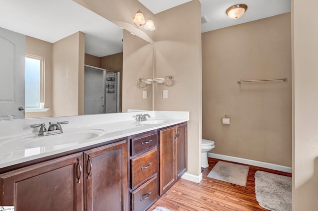 102 Tea Leaf Ct, Anderson, SC 29626 - full bathroom featuring double vanity, a shower stall, and wood finished floors