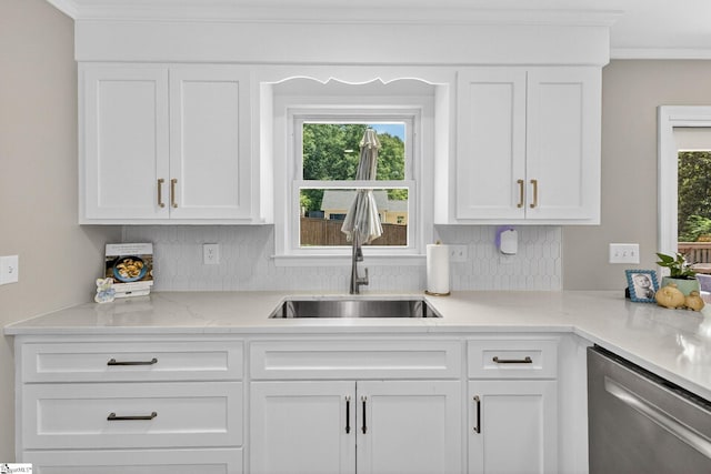 103 W Shallowstone Rd, Greer, SC 29650 - kitchen with stainless steel dishwasher, backsplash, white cabinets, ornamental molding, and light stone countertops