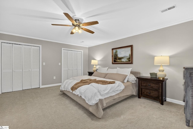 103 W Shallowstone Rd, Greer, SC 29650 - bedroom with two closets, light colored carpet, crown molding, and ceiling fan