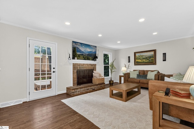 103 W Shallowstone Rd, Greer, SC 29650 - living room with ornamental molding, recessed lighting, wood finished floors, healthy amount of natural light, and a brick fireplace