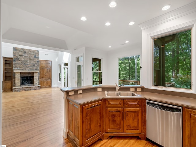 1 Touch Me Not Trl, Landrum, SC 29356 - kitchen with stainless steel dishwasher, light wood finished floors, brown cabinetry, recessed lighting, and a stone fireplace