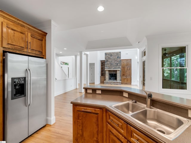 1 Touch Me Not Trl, Landrum, SC 29356 - kitchen featuring stainless steel refrigerator with ice dispenser, brown cabinetry, light wood-type flooring, open floor plan, and recessed lighting
