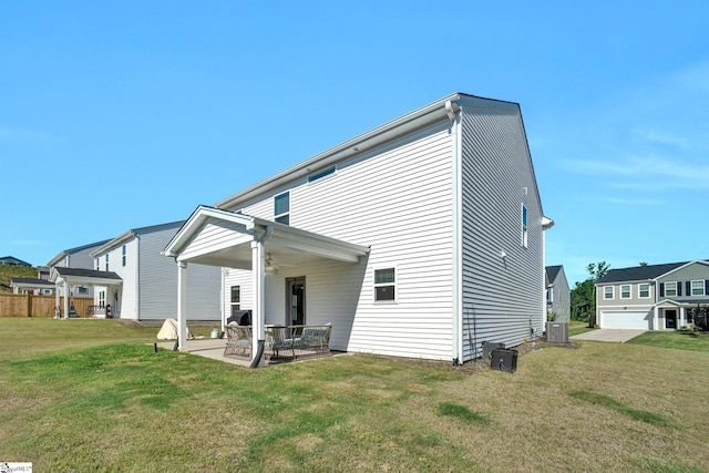 353 Anna Gray Cir, Easley, SC 29640 - rear view of house featuring a ceiling fan, a patio, and a yard