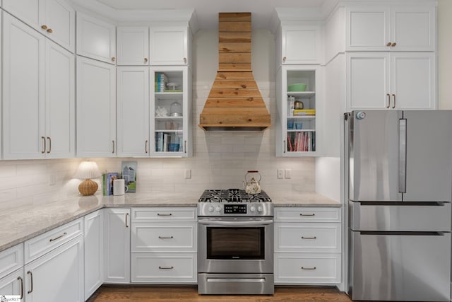 352 Pine Forest Drive Extension, Greenville, SC 29605 - kitchen featuring appliances with stainless steel finishes, custom range hood, white cabinets, and tasteful backsplash