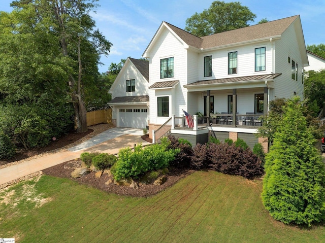 352 Pine Forest Drive Extension, Greenville, SC 29605 - modern farmhouse style home featuring a standing seam roof, covered porch, concrete driveway, a metal roof, and a garage