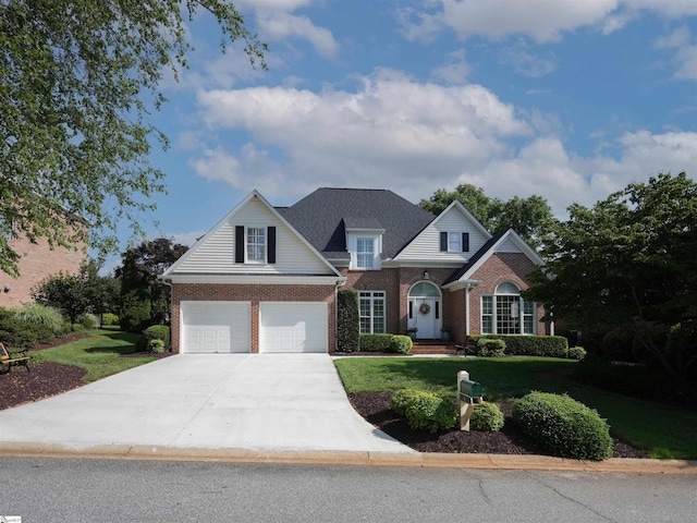 4 Glens Crossing Ct, Greer, SC 29650 - traditional-style home featuring brick siding, a front yard, driveway, and a garage
