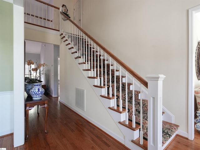 4 Glens Crossing Ct, Greer, SC 29650 - staircase featuring wood finished floors and a towering ceiling