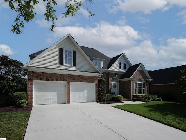 4 Glens Crossing Ct, Greer, SC 29650 - traditional home featuring driveway, brick siding, an attached garage, and a front lawn