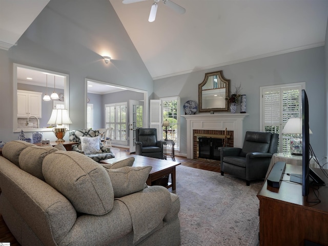 4 Glens Crossing Ct, Greer, SC 29650 - living room featuring crown molding, a fireplace, high vaulted ceiling, wood finished floors, and a ceiling fan