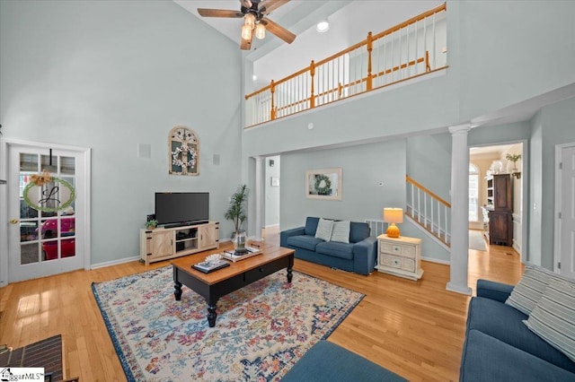 2 Willow Oak Ct, Simpsonville, SC 29681 - living area with ornate columns, high vaulted ceiling, stairs, a ceiling fan, and wood finished floors