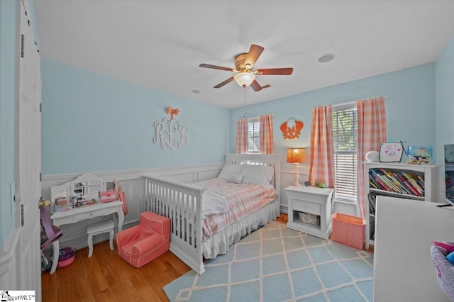 2 Willow Oak Ct, Simpsonville, SC 29681 - bedroom featuring wainscoting, wood finished floors, and ceiling fan