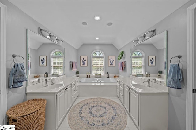 2 Willow Oak Ct, Simpsonville, SC 29681 - full bath featuring vaulted ceiling, a bath, two vanities, tile patterned flooring, and recessed lighting