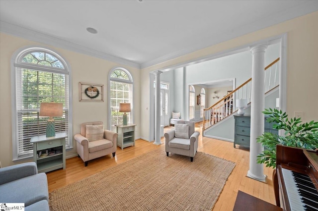 2 Willow Oak Ct, Simpsonville, SC 29681 - living area featuring decorative columns, stairs, light wood-style floors, and ornamental molding
