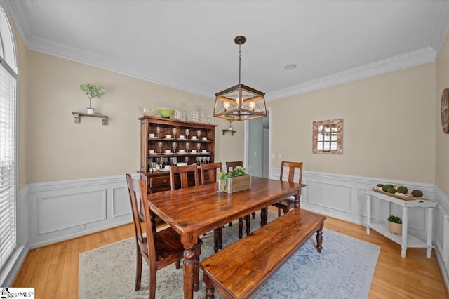 2 Willow Oak Ct, Simpsonville, SC 29681 - dining space featuring crown molding, light wood finished floors, a chandelier, and a wainscoted wall
