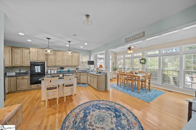 2 Willow Oak Ct, Simpsonville, SC 29681 - kitchen featuring a ceiling fan, light brown cabinets, a center island, light wood-style flooring, and recessed lighting