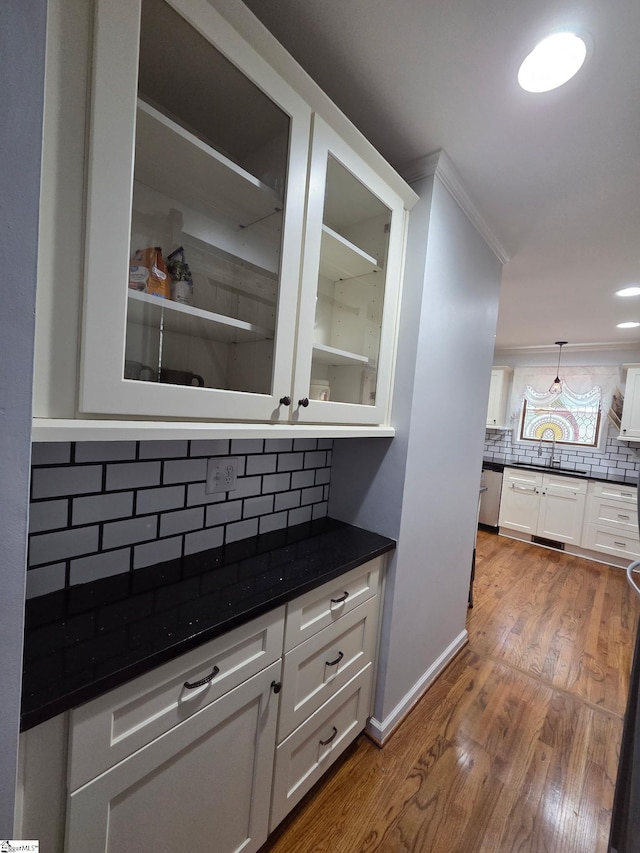 105 Devonshire Ln, Greenville, SC 29617 - bar area featuring decorative backsplash, dark wood-type flooring, and stainless steel dishwasher