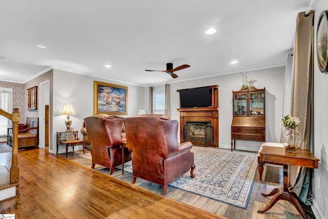 105 Devonshire Ln, Greenville, SC 29617 - living area featuring a fireplace, ceiling fan, plenty of natural light, wood finished floors, and crown molding