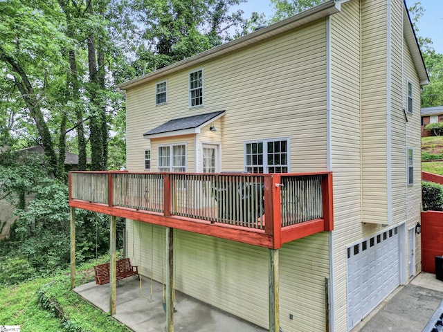 105 Devonshire Ln, Greenville, SC 29617 - back of property featuring a garage, a patio area, driveway, and a deck