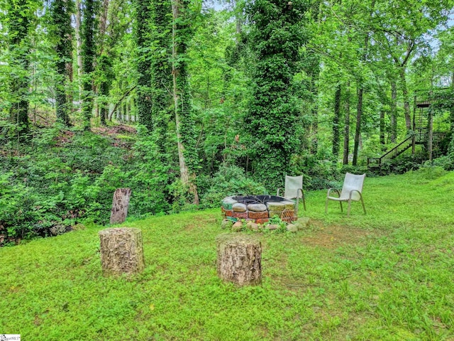105 Devonshire Ln, Greenville, SC 29617 - view of green lawn featuring a fire pit and stairway