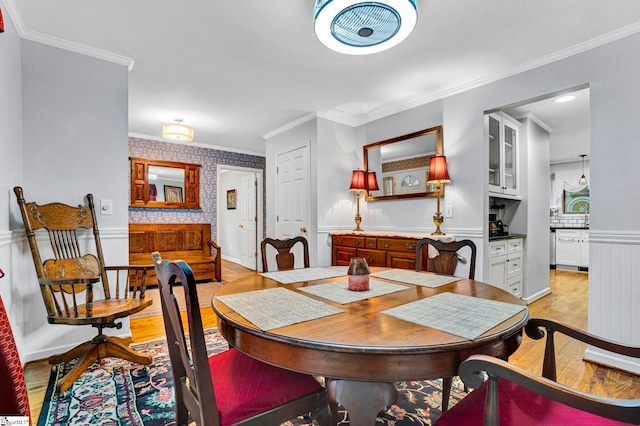 105 Devonshire Ln, Greenville, SC 29617 - dining space featuring light wood-type flooring, wainscoting, and crown molding