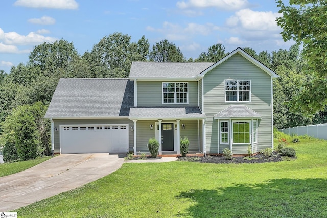 34 Perkins Ct, Greer, SC 29651 - traditional home with a garage, driveway, a shingled roof, and a porch