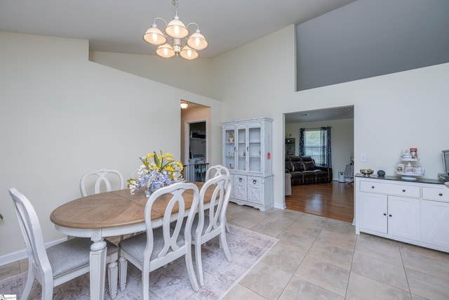 6 Gratiot Ln, Greer, SC 29651 - dining space featuring light tile patterned flooring, a chandelier, and high vaulted ceiling