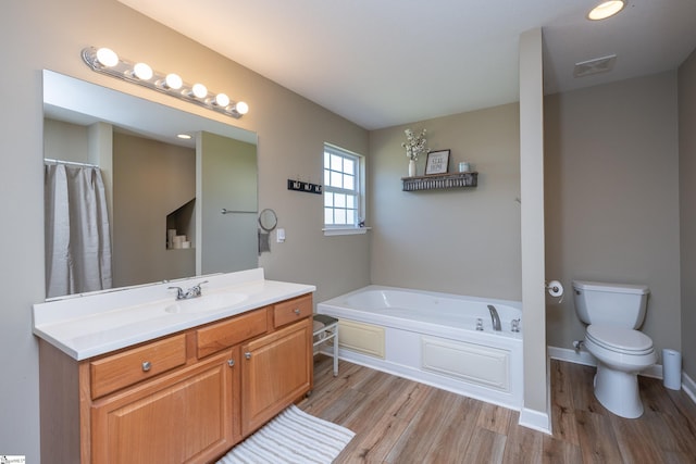 6 Gratiot Ln, Greer, SC 29651 - full bath featuring wood finished floors, a garden tub, and vanity