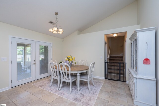 6 Gratiot Ln, Greer, SC 29651 - dining area featuring french doors, vaulted ceiling, stairway, a chandelier, and light tile patterned floors