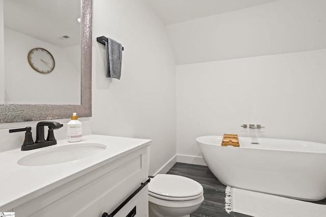 421 Lynn Rd, Taylors, SC 29687 - bathroom featuring a freestanding bath, vanity, and wood finished floors