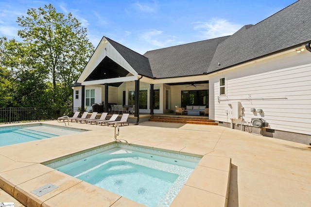 421 Lynn Rd, Taylors, SC 29687 - view of swimming pool featuring ceiling fan, an in-ground hot tub, a patio, and an outdoor living space