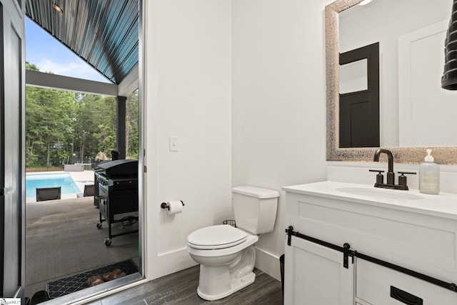 421 Lynn Rd, Taylors, SC 29687 - bathroom with vanity and wood finished floors