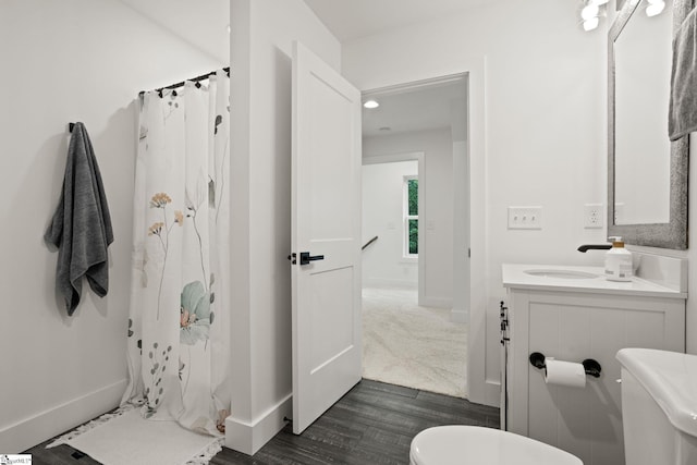 421 Lynn Rd, Taylors, SC 29687 - full bath with vanity, curtained shower, and wood finished floors