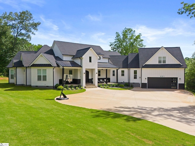 421 Lynn Rd, Taylors, SC 29687 - modern farmhouse style home with concrete driveway, a standing seam roof, a front yard, a garage, and crawl space