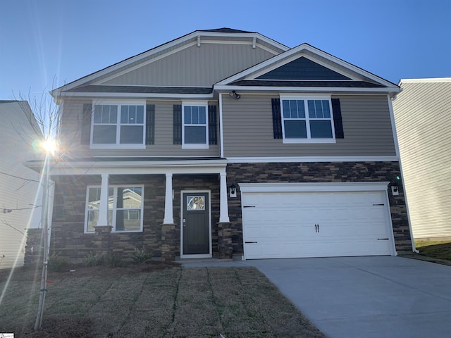 4322 Remington Ave, Boiling Springs, SC 29316 - craftsman-style house with stone siding, a garage, concrete driveway, and a porch