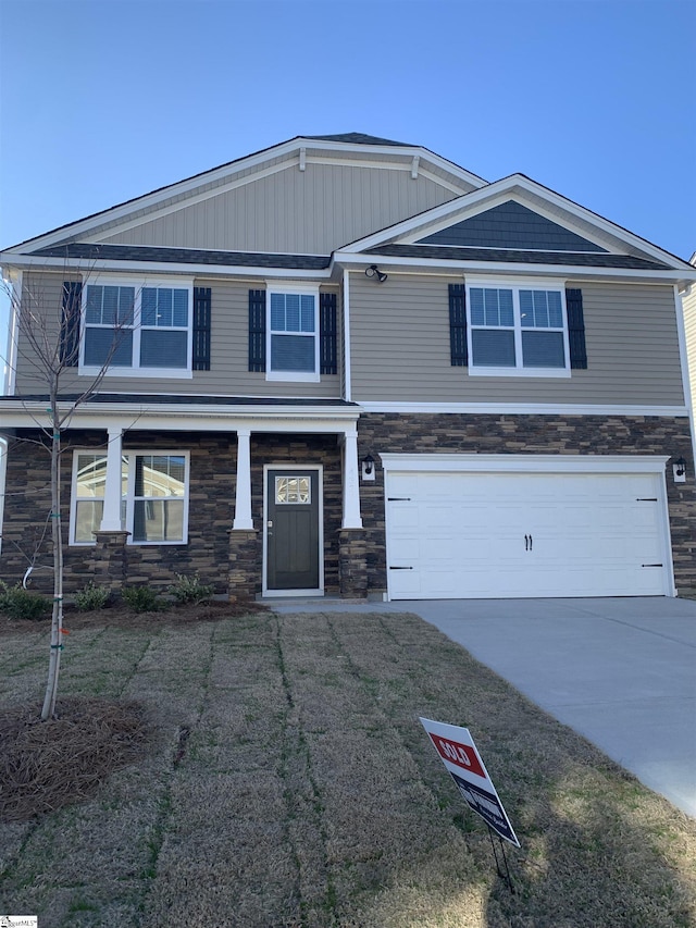 4322 Remington Ave, Boiling Springs, SC 29316 - view of front of property with stone siding, a garage, and driveway