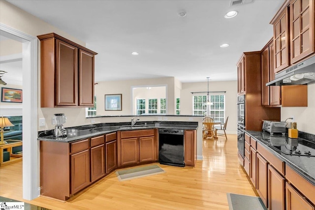 109 Amberleaf Way, Simpsonville, SC 29681 - kitchen featuring black appliances, under cabinet range hood, light wood-style flooring, a peninsula, and recessed lighting