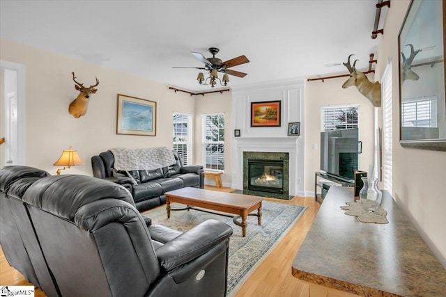 109 Amberleaf Way, Simpsonville, SC 29681 - living room with a fireplace with flush hearth, ceiling fan, healthy amount of natural light, and light wood finished floors