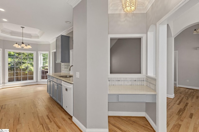 10 Parkcrest Ct, Simpsonville, SC 29681 - kitchen with a chandelier, white dishwasher, gray cabinetry, light wood-type flooring, and crown molding