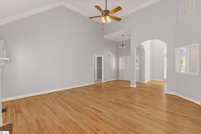 10 Parkcrest Ct, Simpsonville, SC 29681 - unfurnished living room featuring high vaulted ceiling, arched walkways, a ceiling fan, light wood-style flooring, and crown molding