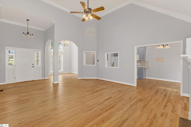 10 Parkcrest Ct, Simpsonville, SC 29681 - unfurnished living room with a chandelier, arched walkways, light wood-style flooring, high vaulted ceiling, and a ceiling fan