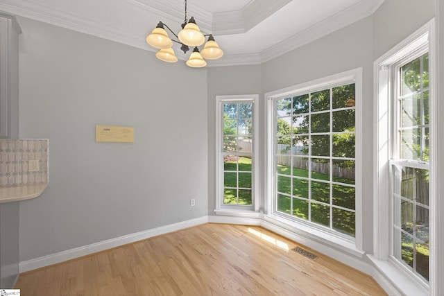 10 Parkcrest Ct, Simpsonville, SC 29681 - empty room featuring a chandelier, light wood-style floors, and crown molding