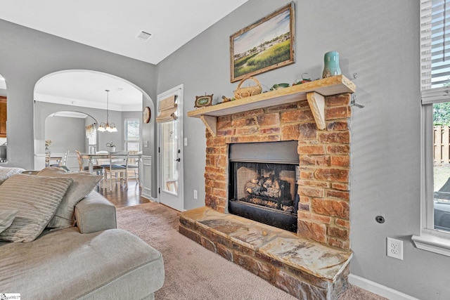 112 Cameron Creek Ln, Simpsonville, SC 29681 - living area with arched walkways, carpet, and a fireplace