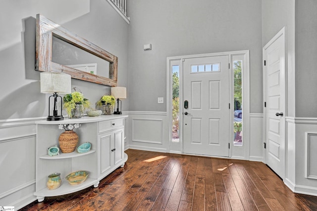 112 Cameron Creek Ln, Simpsonville, SC 29681 - foyer with dark wood finished floors, a wainscoted wall, a decorative wall, and a towering ceiling